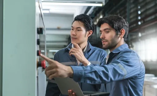 Technicians use machine controls during a tech upgrade
