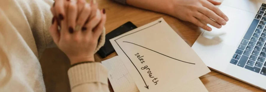 A paper featuring a graph labeled "sales growth," illustrating a critical change that doubled output.