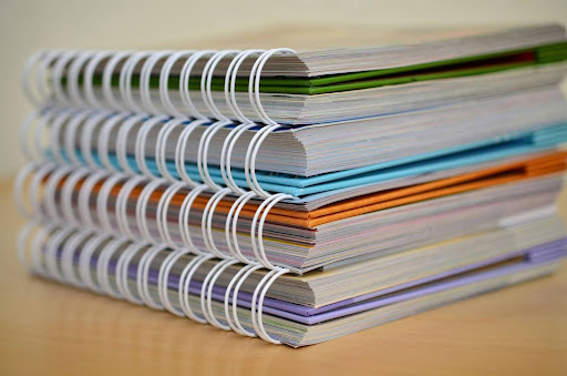 Stack of documents arranged neatly to symbolize organized process documentation.